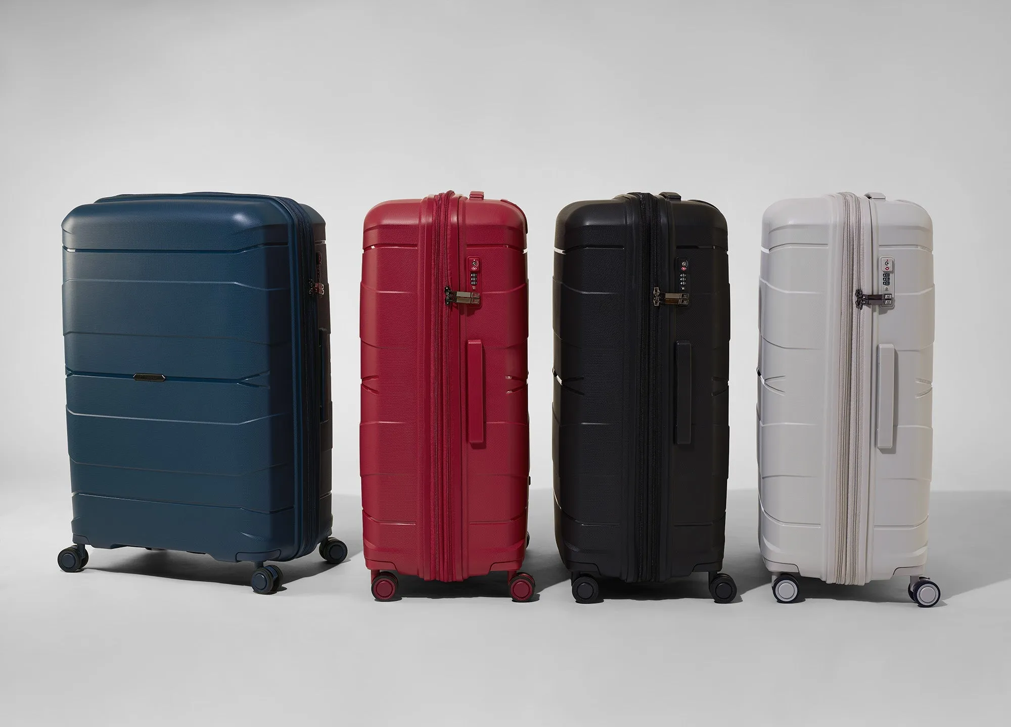 Momentous 25" Hardside Checked 8 Wheel Expandable Spinner (Pumice Stone)