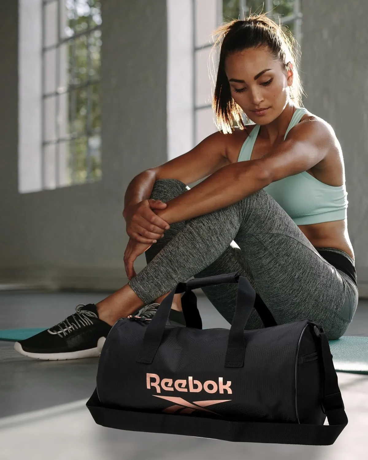 Reebok Duffle Bag - Unisex Lightweight Gym, Sports and Travel Carry On Weekender Bag for Men and Women, Size One Size, Plyo Jet Black With Rose Logo
